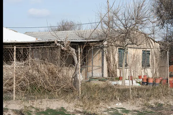 Photo by Theologos Christodoulou: https://www.pexels.com/photo/exterior-of-an-abandoned-house-15557000/