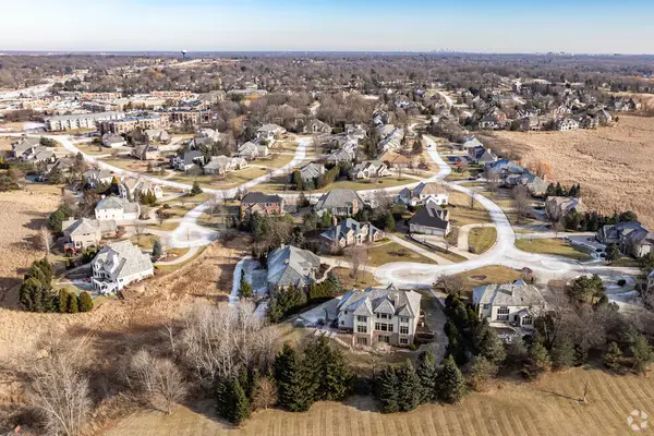 Aerial view of a curving suburban neighborhood with large lots in Brookfield, WI