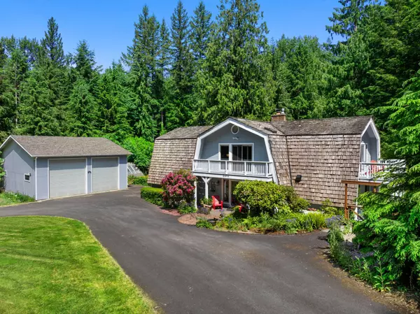 Enchanting Mt. Hood Estate: Lush Gardens, Expansive Shop & Storybook Home on Sprawling Acreage
