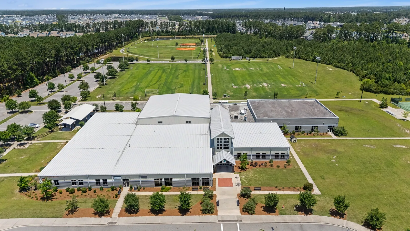 Aerial view of Cane Bay Family YMCA in Summerville SC with athletic fields and surrounding residential neighborhood