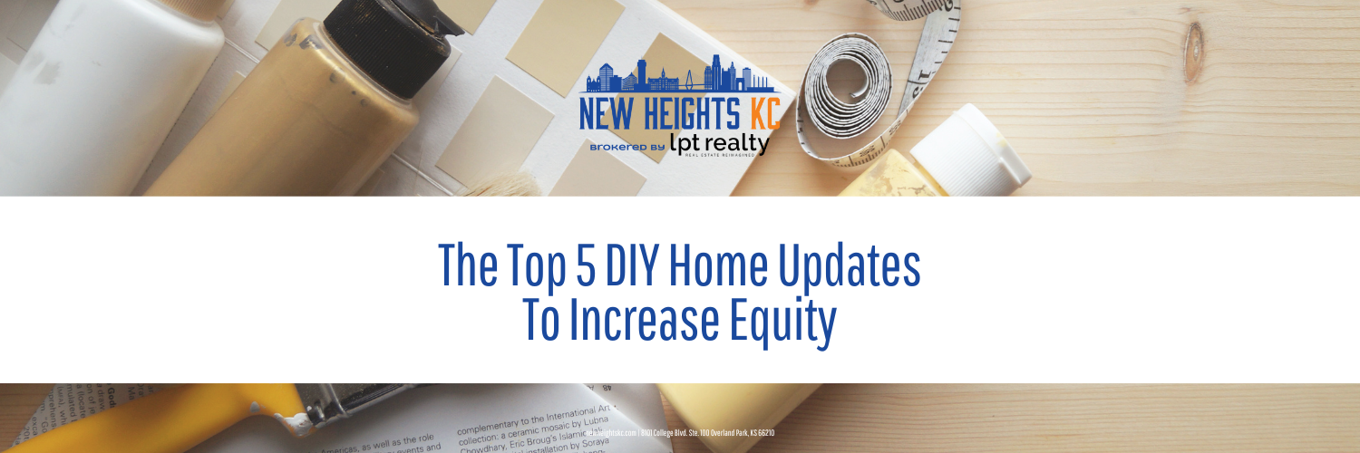 Home improvement supplies, including paint swatches, measuring tape, and containers, are arranged on a light-colored wooden surface, with text overlay reading "The Top 5 DIY Home Updates To Increase Equity."