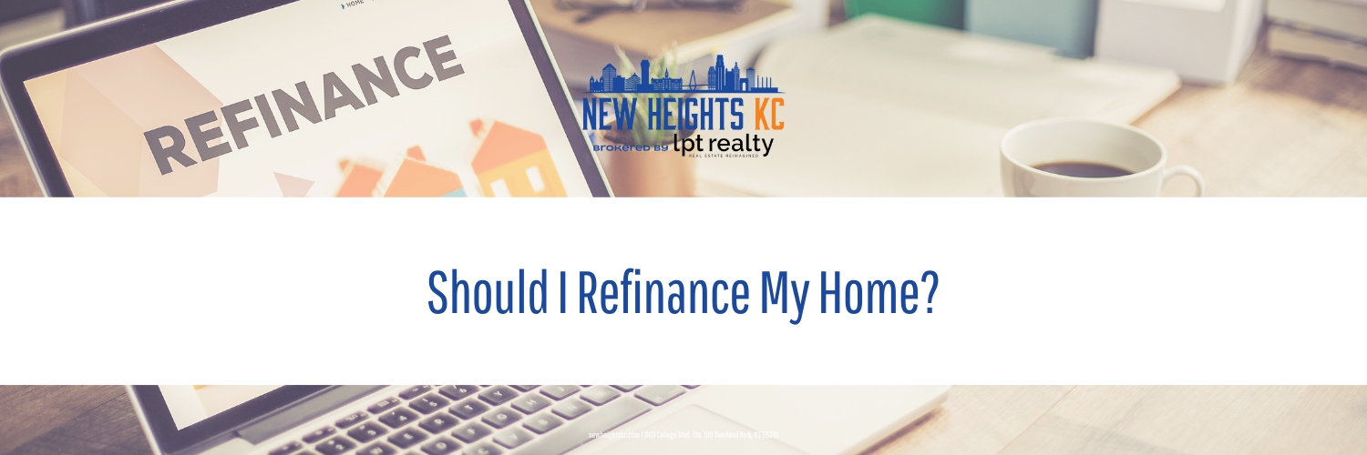Laptop screen displaying "REFINANCE" and the question "Should I Refinance My Home?".