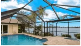 Own Your Dream Home With Beautiful Lake Views From Your Lanai with Pool and Spa!