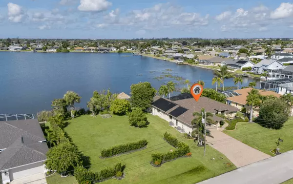 Awesome Lake Views! Own Your Dream Home in This Cape Coral Pool home with Large Boat Dock!