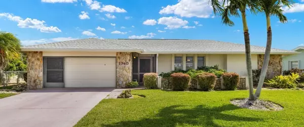 Wake Up to Paradise in This Exquisite Sailboat-Acess Waterfront Home!
