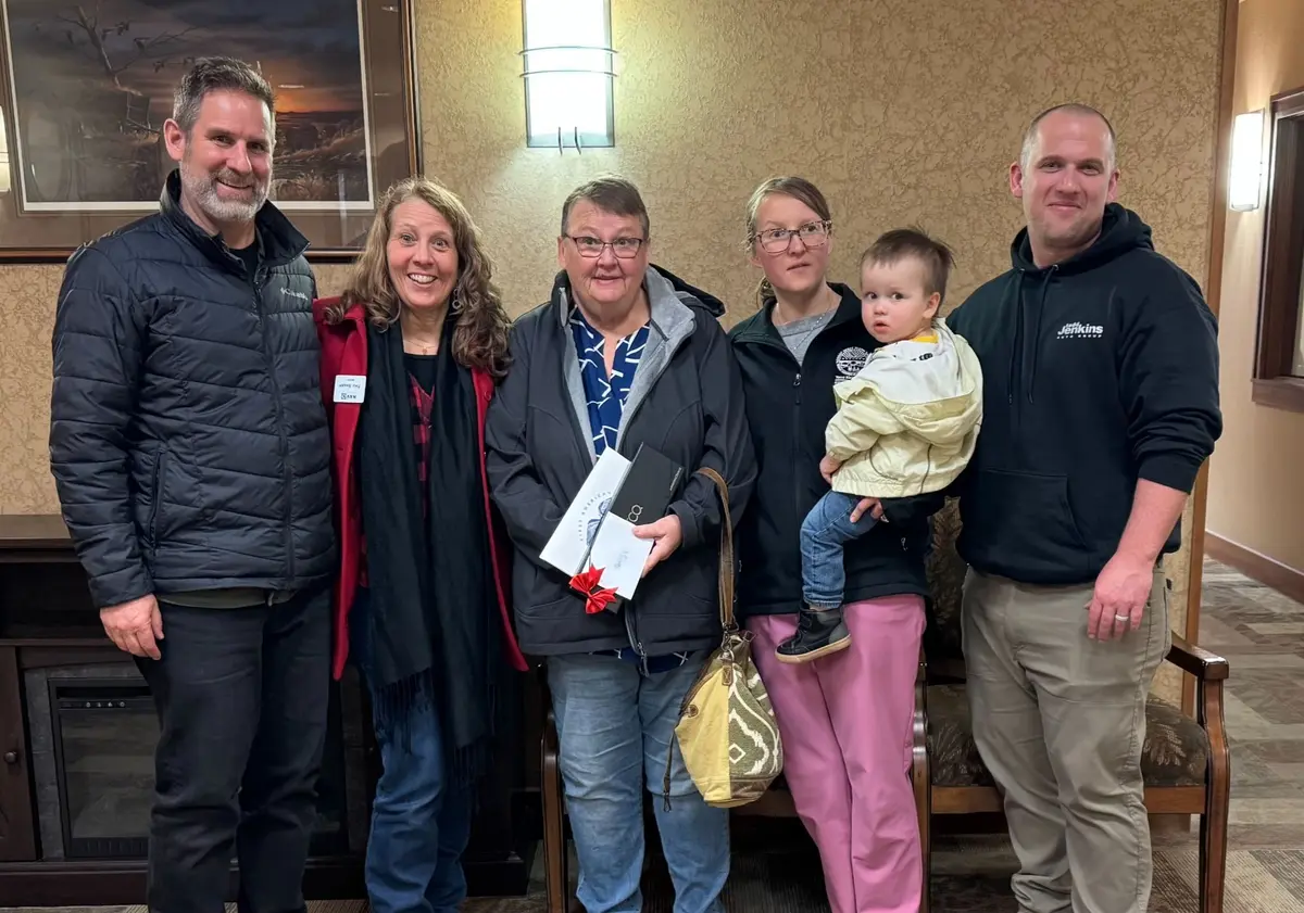 Arnie and Tina Sharp celebrating a successful home purchase with clients in Rapid City South Dakota