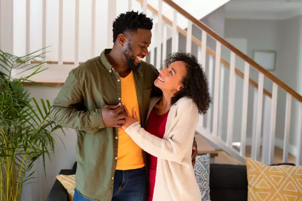 happy-african-american-couple-hugging-and-looking-2025-04-03-00-59-57-utc
