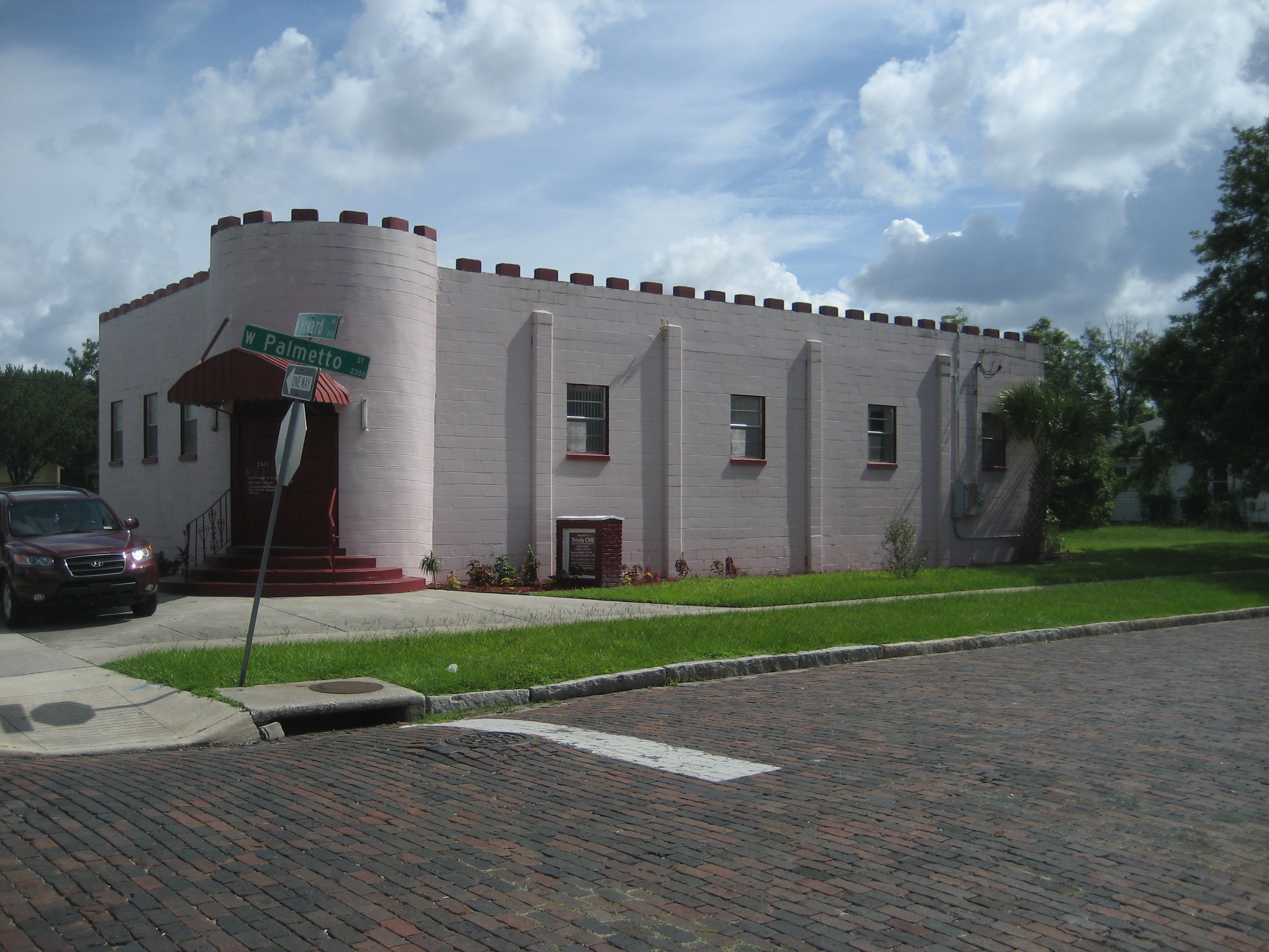 Castle-style building on a brick street in West Tampa