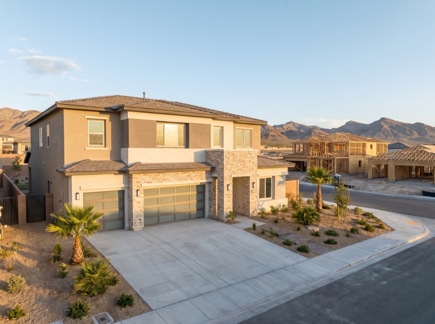 Illustration of a new desert home with fresh framing on the lot next door.
