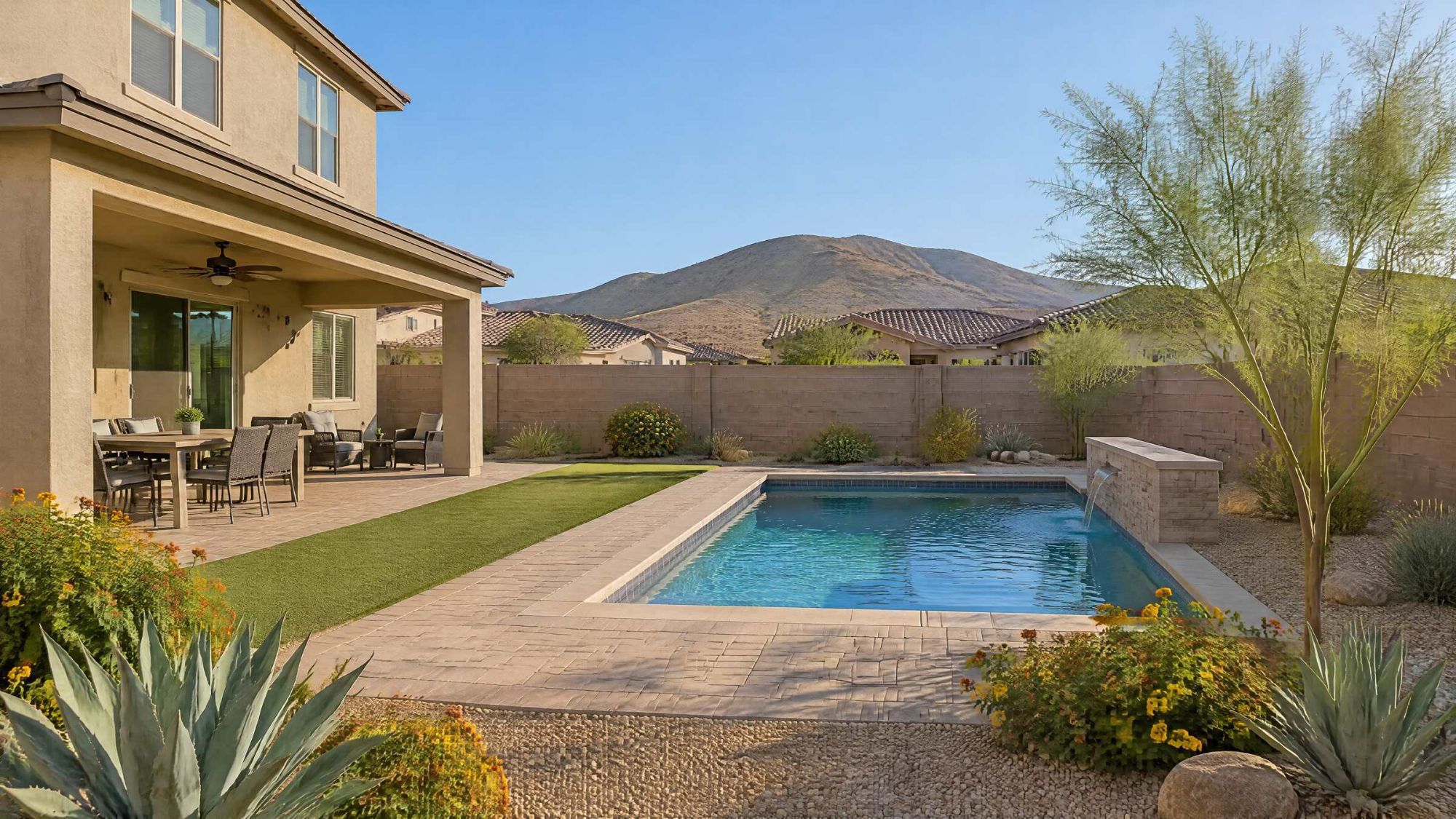 Illustration of a desert backyard with a covered patio and a small pool.