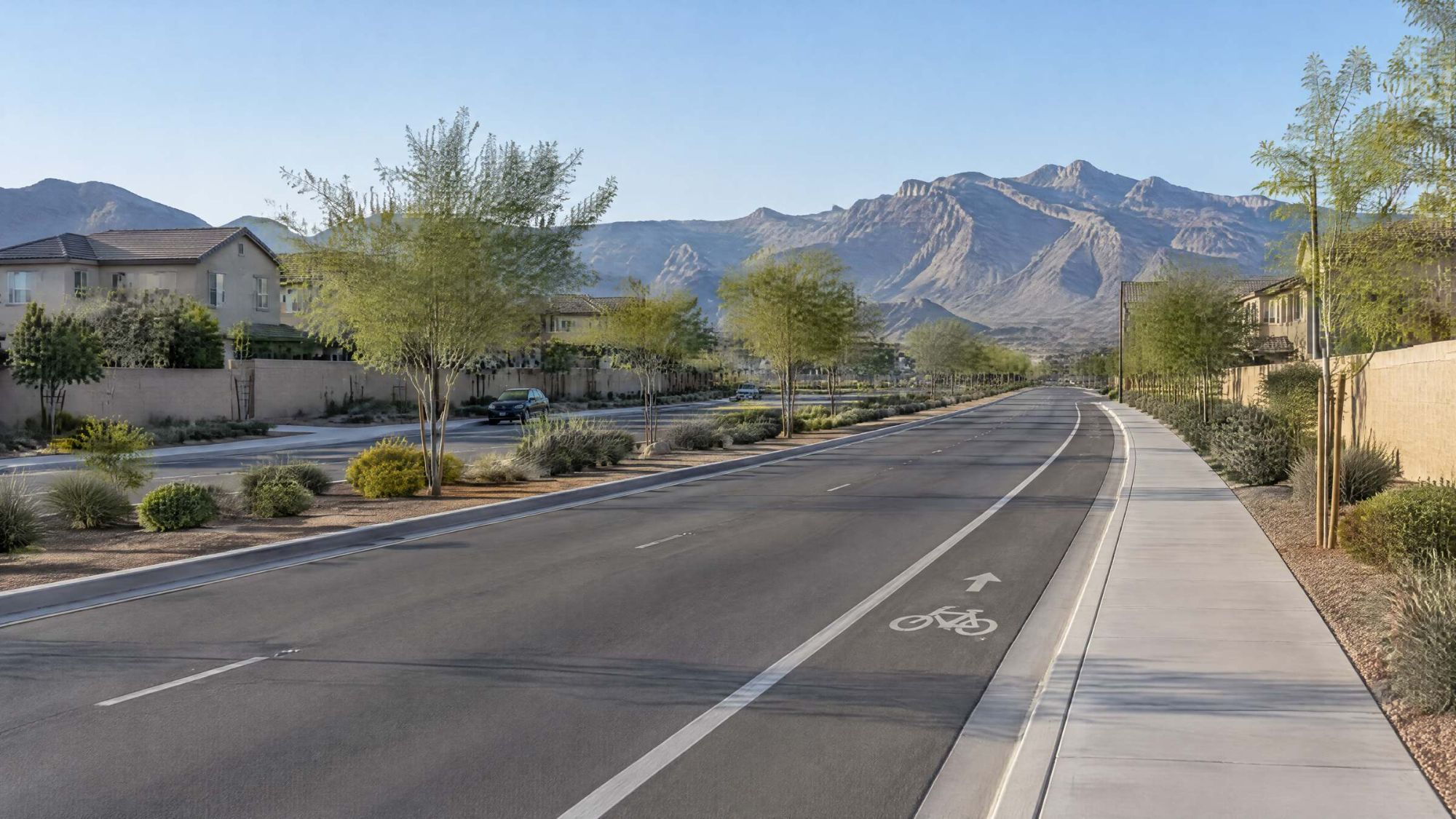Illustration of a landscaped parkway with a bike lane and desert median, mountains to the west.