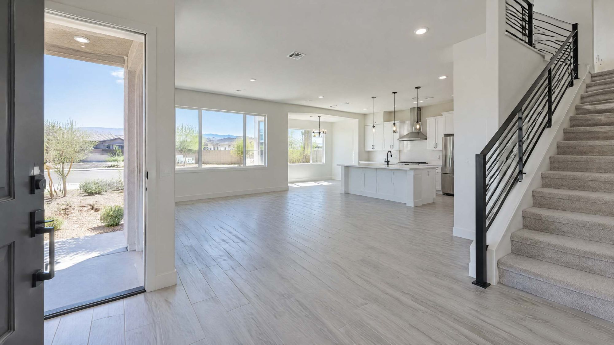 Illustration of the open entry and great room of an empty home.