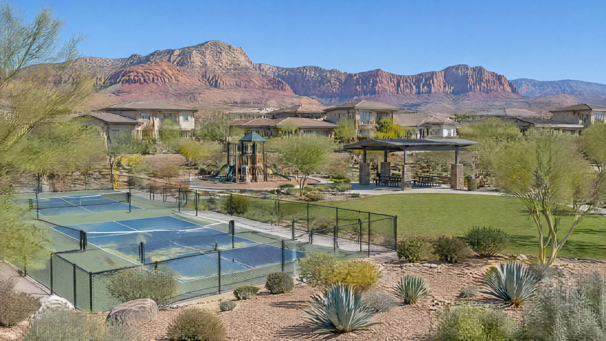 Illustration of a desert neighborhood park with pickleball courts, shade and red rock cliffs behind.