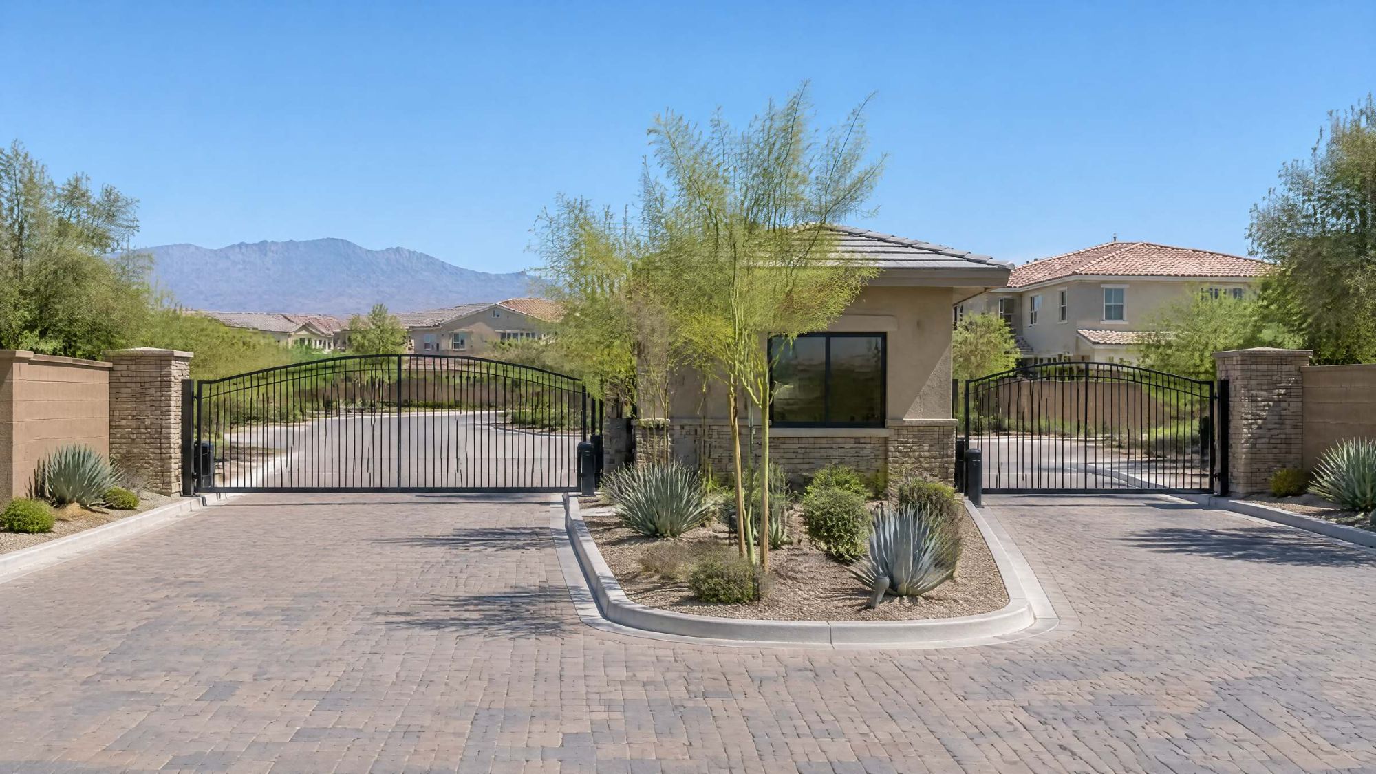 Illustration of a guard-gated neighborhood entry with a small gatehouse and desert landscaping.