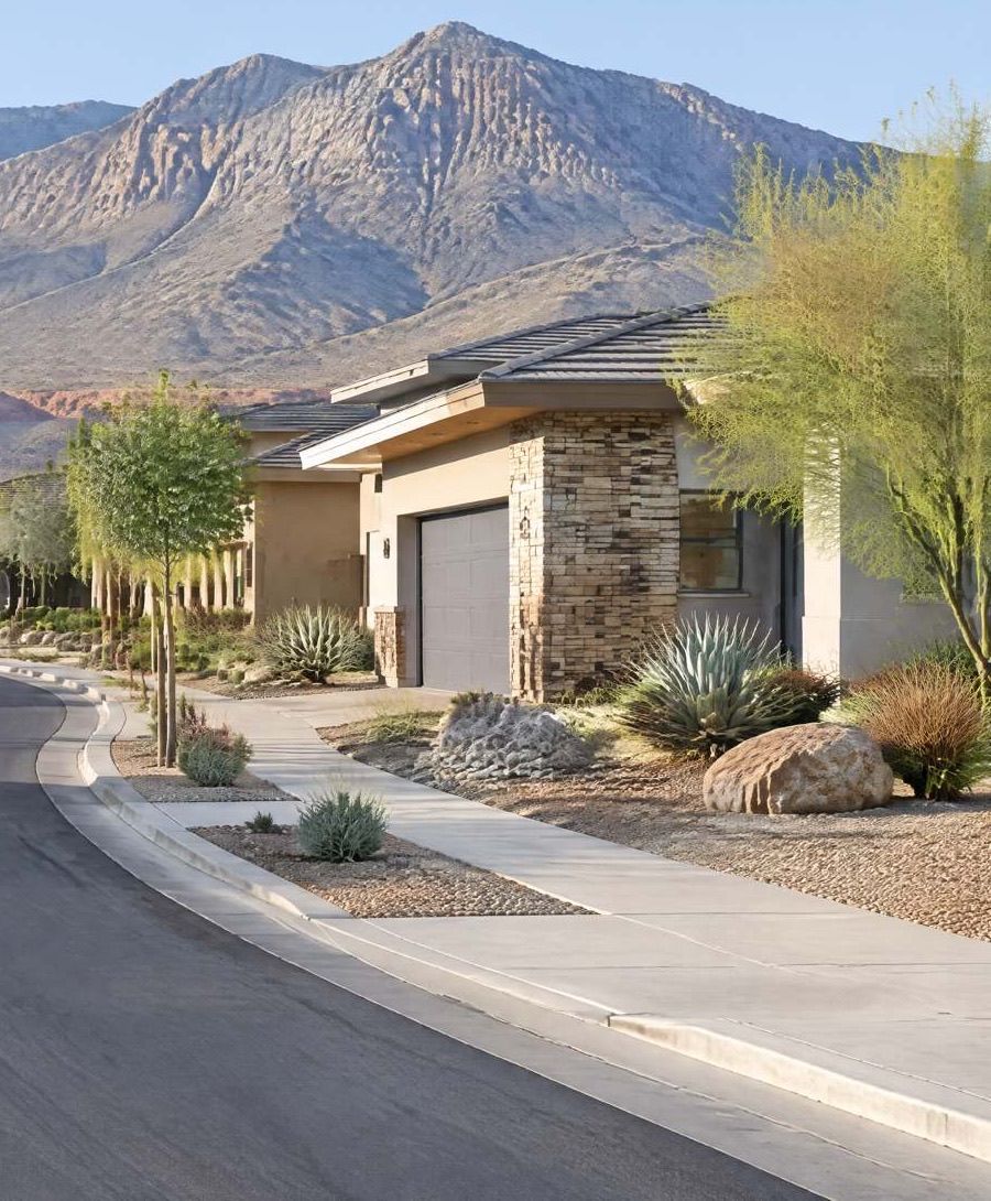 Illustration of a newer desert home with stacked stone and a two-car garage.