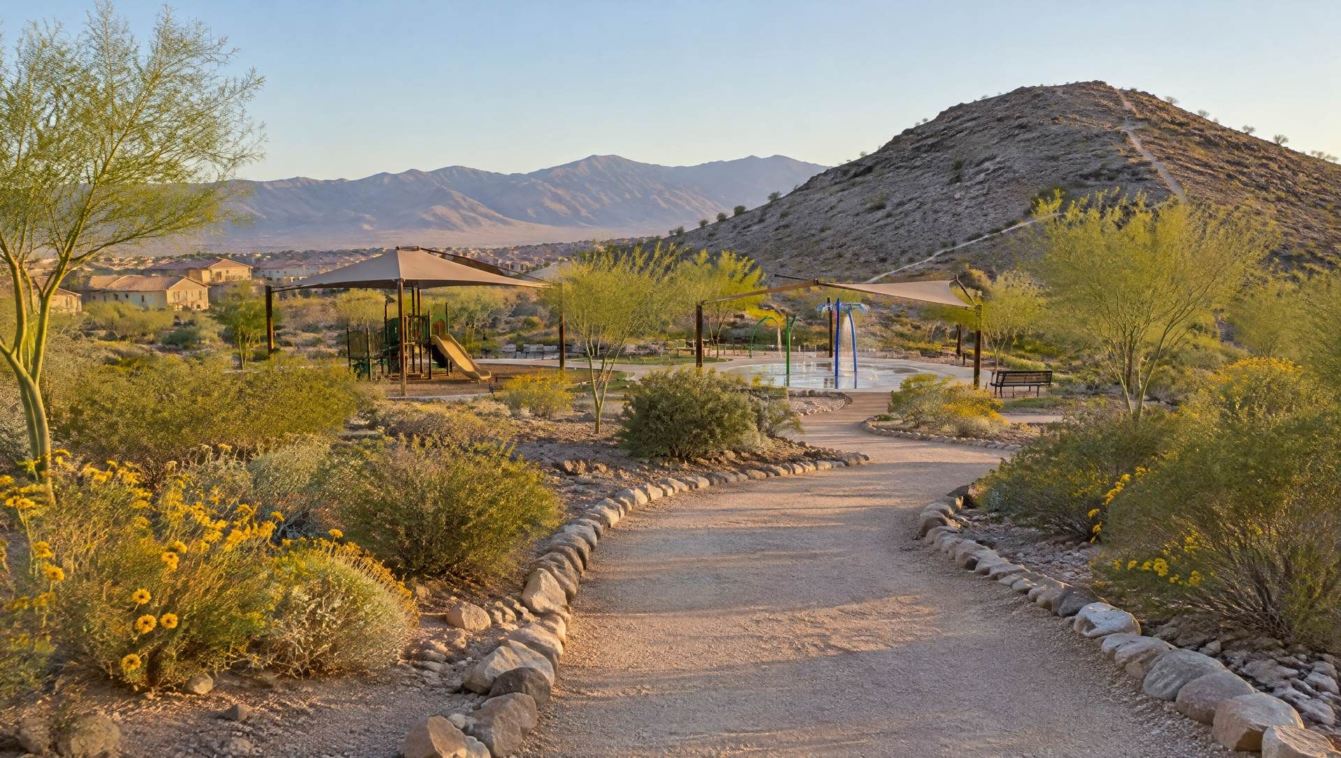 Illustration of a desert park path leading to a playground, a splash pad and a rocky hill trail.