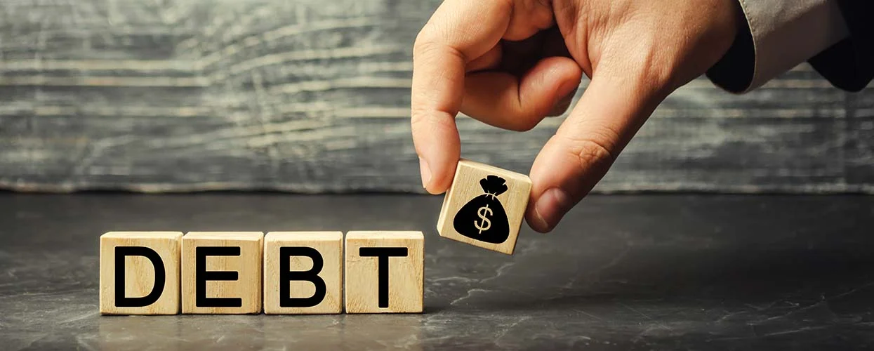 Blocks that spell out the word, "Debt"