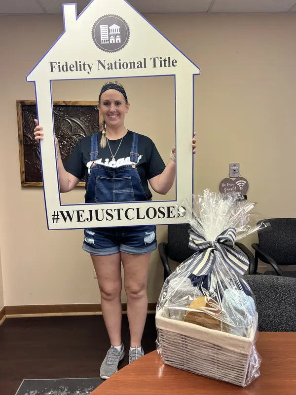 Happy first-time homebuyers receiving keys in Will County, after a successful closing with Cristina Gluszek