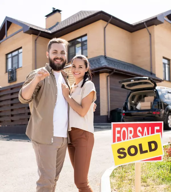happy-couple-against-new-house-2025-03-16-09-59-15-utc (1)