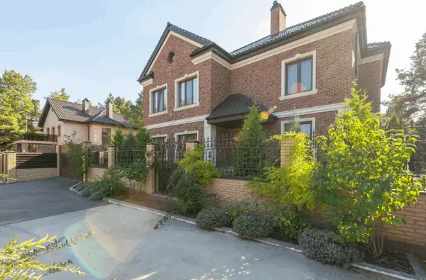 feature image of Should You Buy the Nicest House in the Neighborhood? The Hidden Risks & Rewards