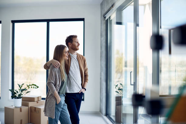 Renter looking out apartment window