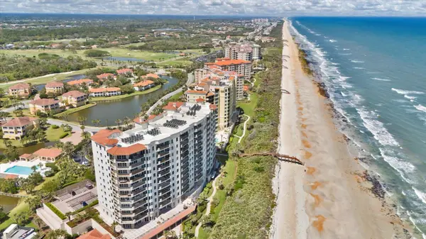 Oceanfront condominium tower and beach boardwalks at Hammock Dunes in Palm Coast FL