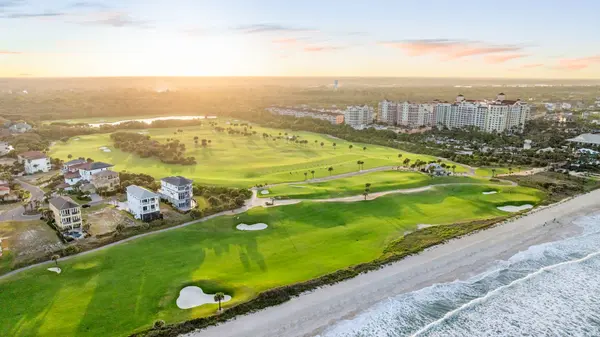 Aerial view of Hammock Beach Resort and the oceanfront Ocean Course at sunrise in Palm Coast FL