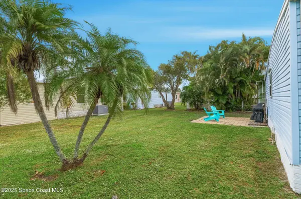 1209 Gardenia DR, Barefoot Bay, FL 32976