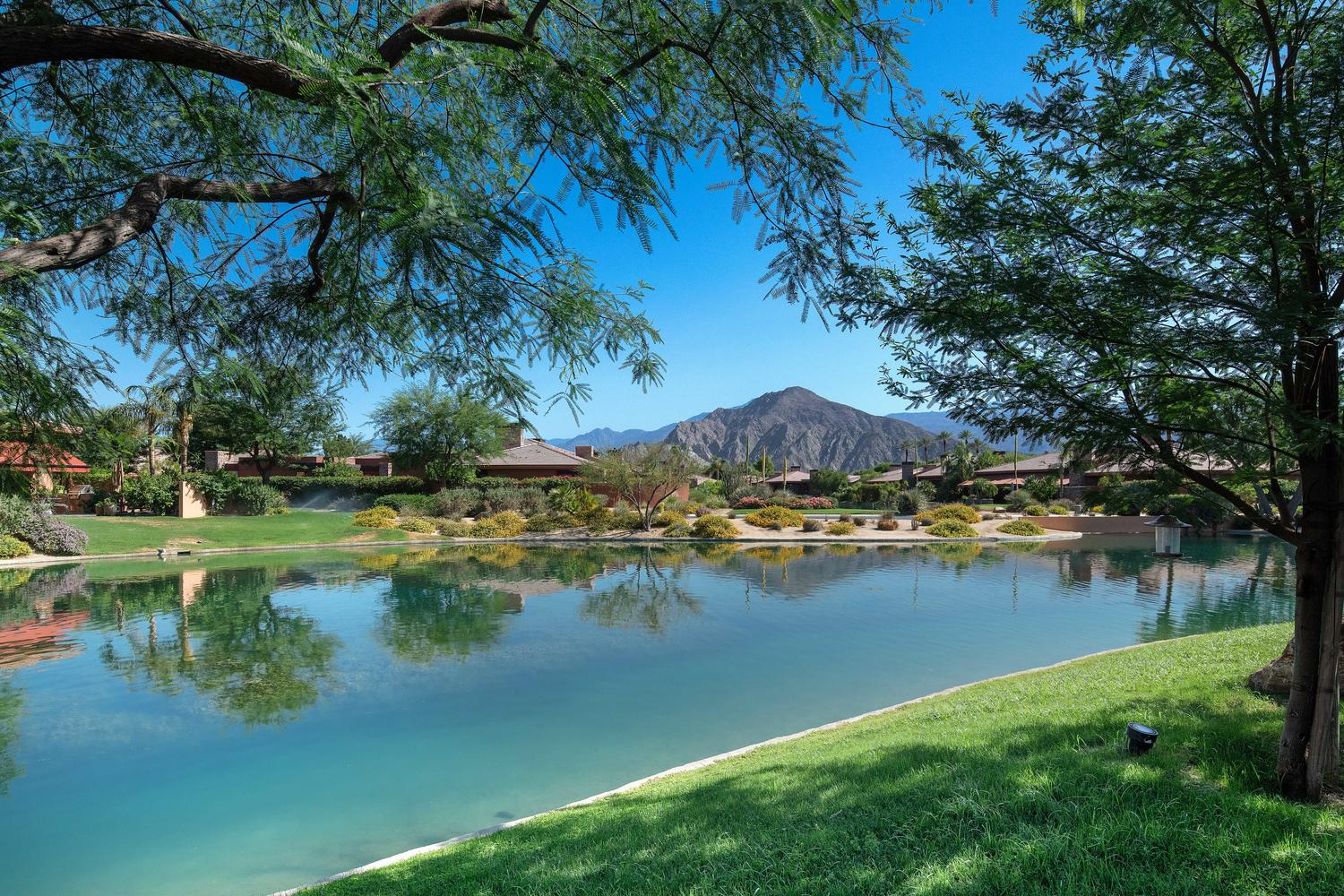 Palmilla in La Quinta, California, with expansive water features, mature desert landscaping and Santa Rosa Mountain views
