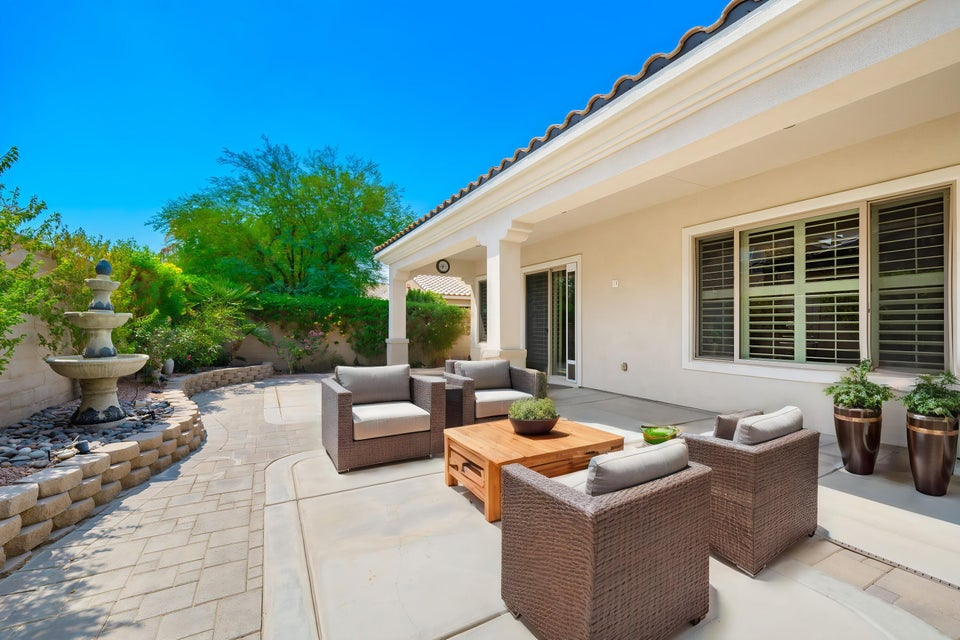 Private outdoor living patio with desert landscaping at a Sun City Shadow Hills home in Indio