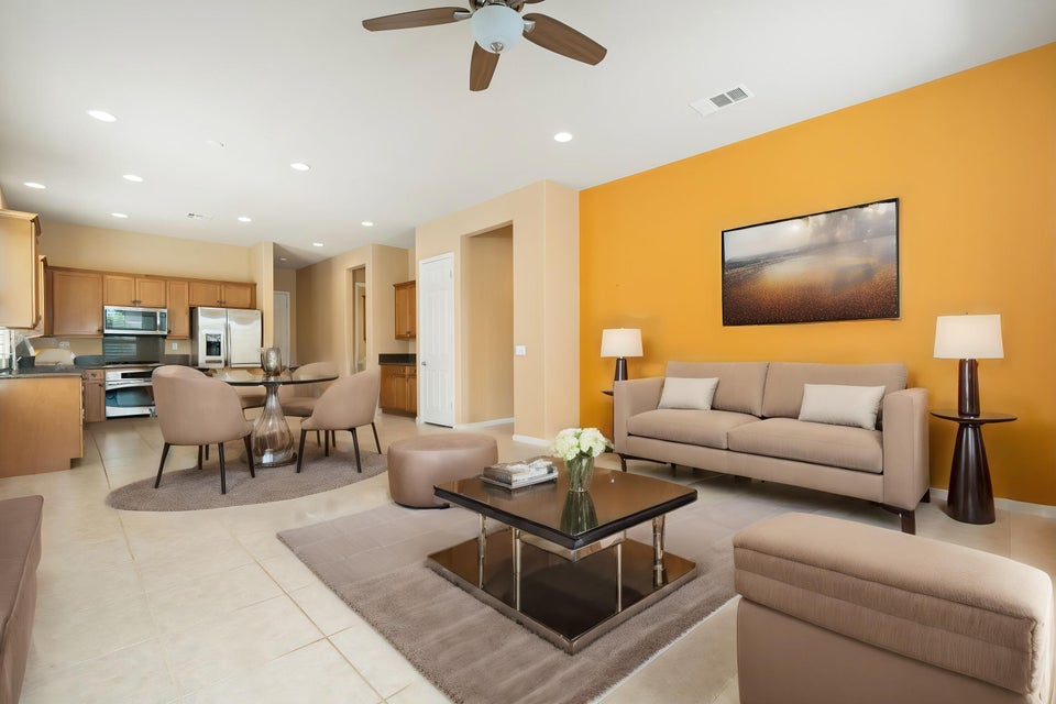 Open-concept living, dining and kitchen area inside a Sun City Shadow Hills home in Indio, California