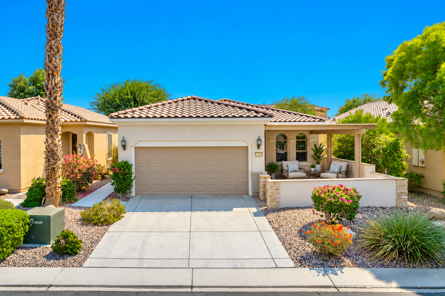Sun City Shadow Hills home in Indio with virtually staged front courtyard and covered outdoor living area