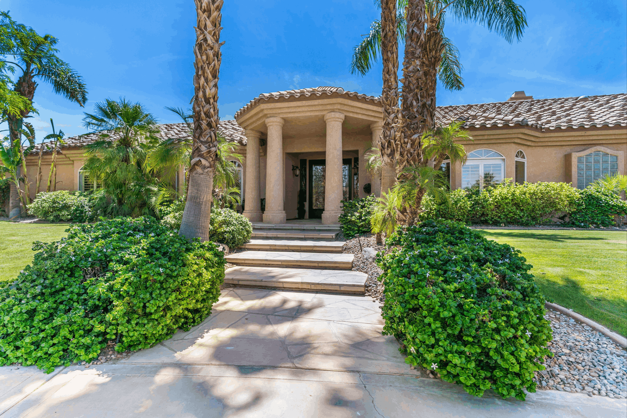 Bermuda Dunes Country Club residence with mature desert landscaping and established architectural character in Bermuda Dunes, California