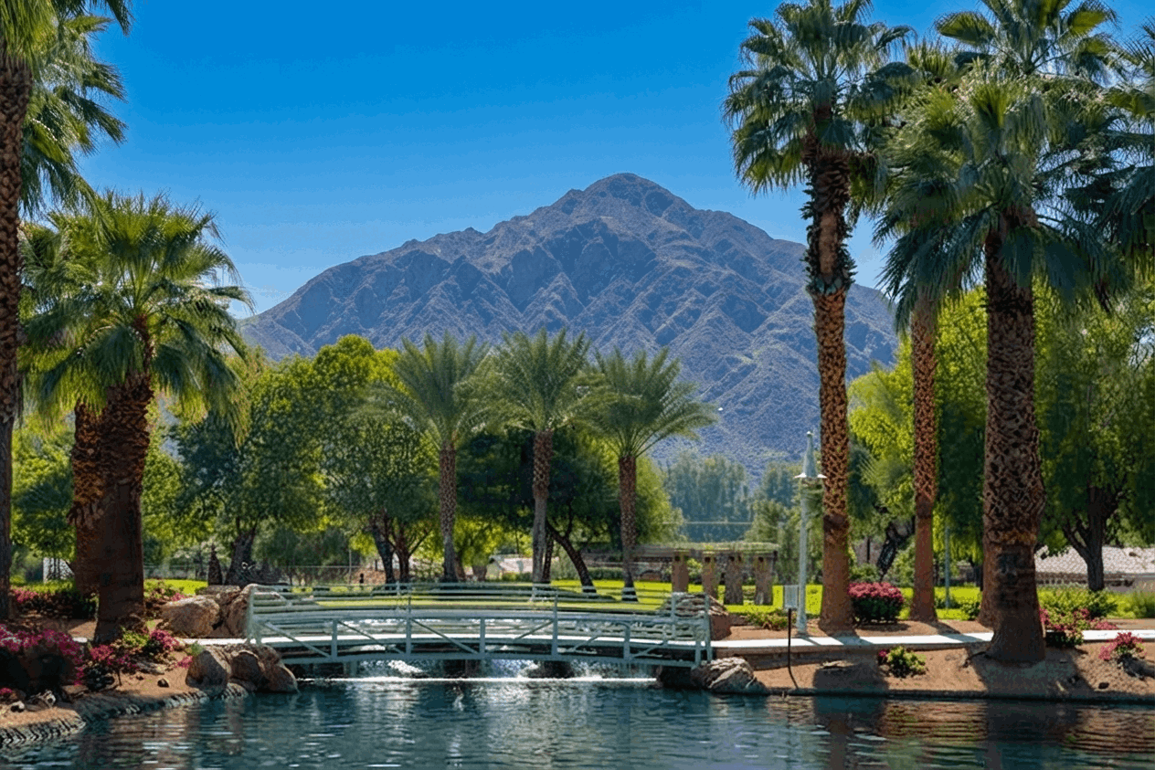 Mountain view across landscaped park, palm trees and pond near La Quinta Cove