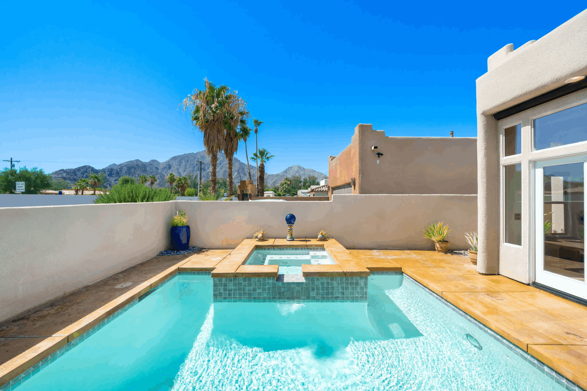 Private swimming pool and spa with mountain views at a home in La Quinta Cove