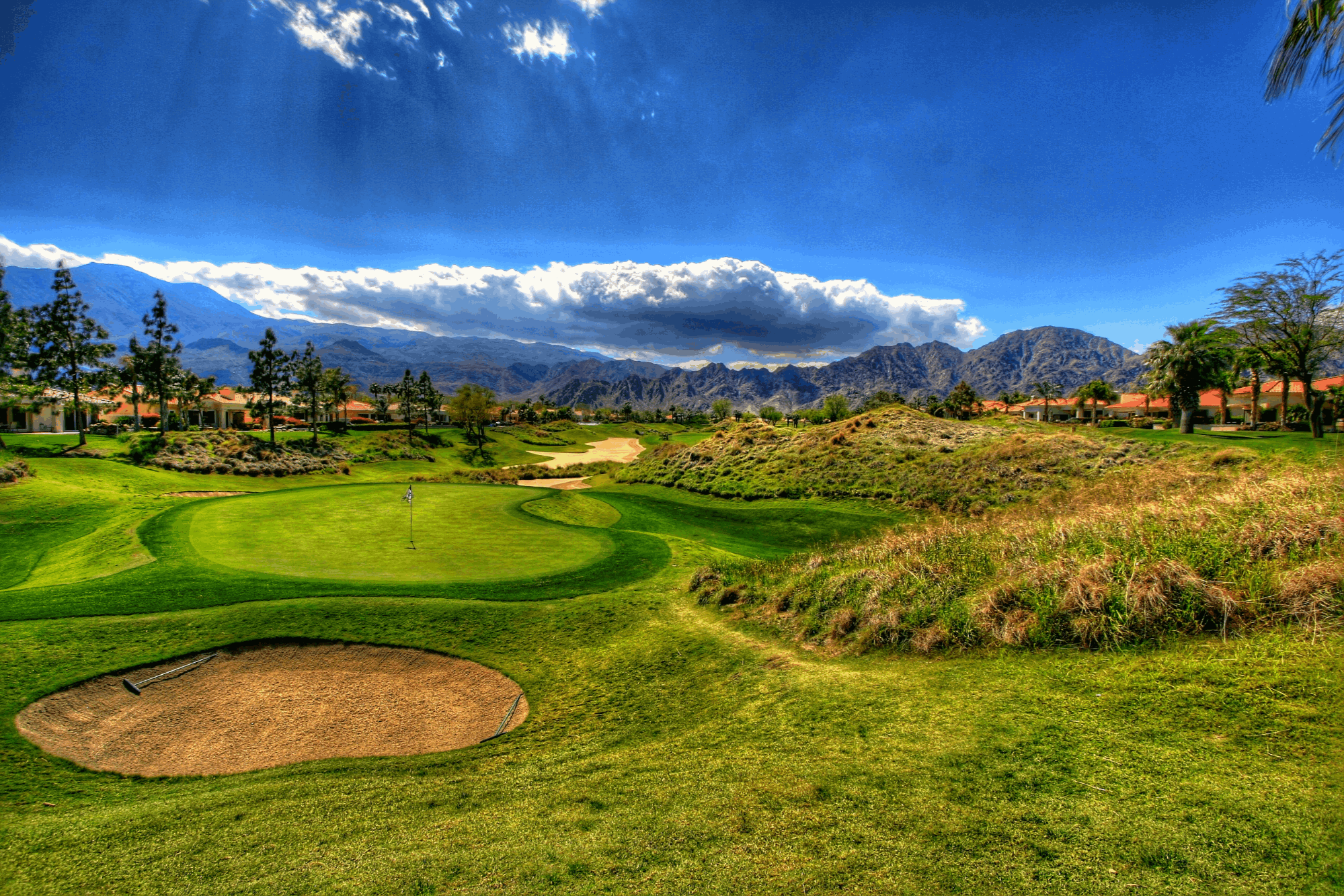 Nicklaus Private golf course at PGA WEST with homes and mountains in La Quinta, California