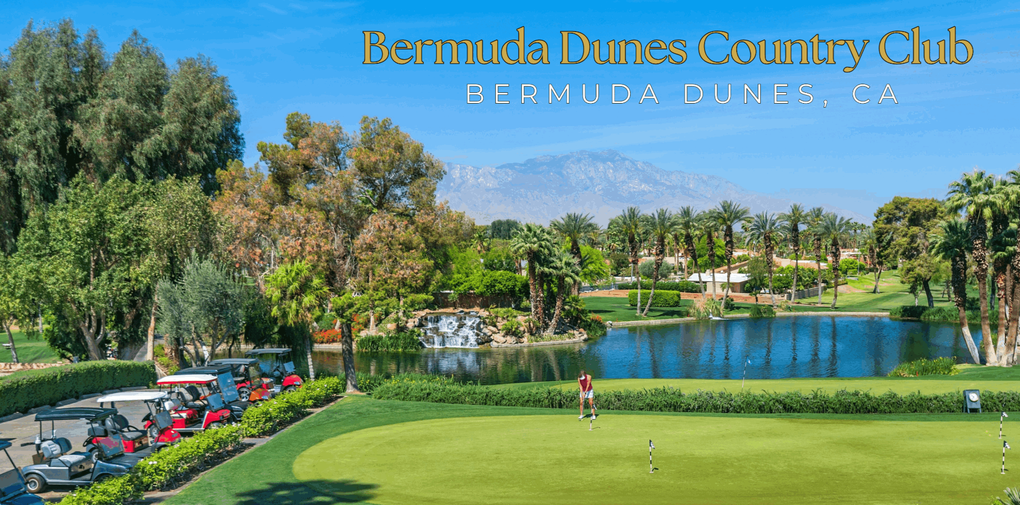 Bermuda Dunes Country Club golf course with lake, waterfall, mature trees, palm trees and mountain views in Bermuda Dunes, California