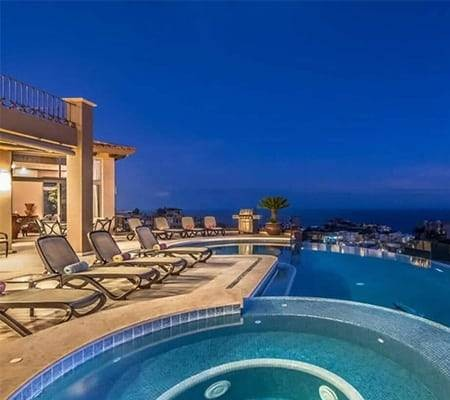 Cabo San Lucas view with pool and lounge chairs