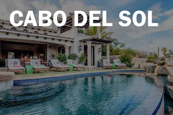 A luxurious property with a pool and lounge chairs