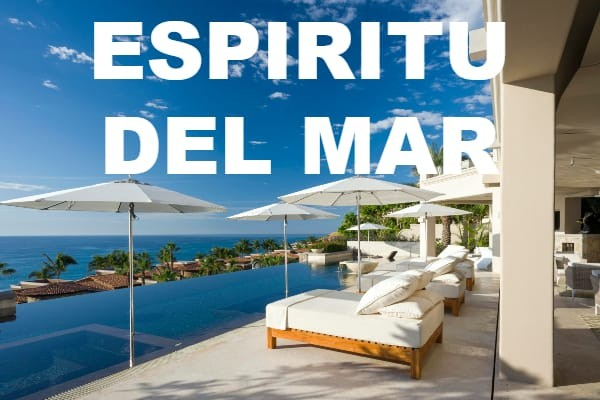 A luxurious property with a pool and lounge chairs