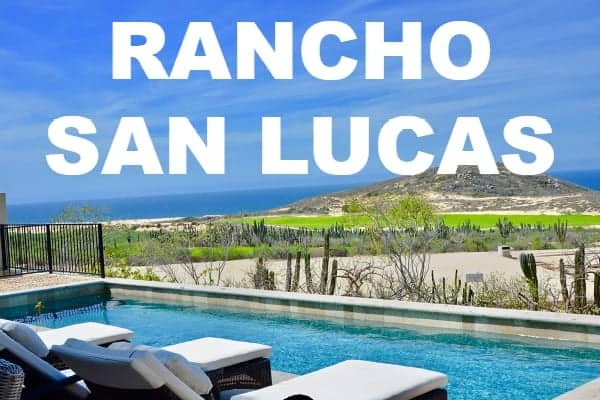A luxurious property with a pool and lounge chairs