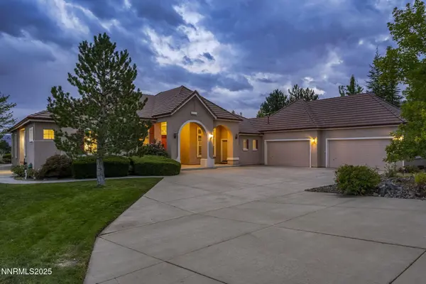 Front view of a residential home facade in Reno, Nevada, showing the exterior structure, entrance, and front yard.