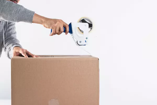 Tape Dispenser to close up a box to clear up clutter Vision Realty