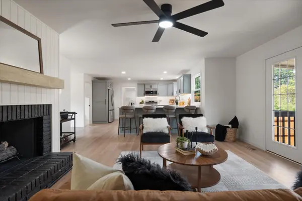 Living room with fireplace and open floor plan