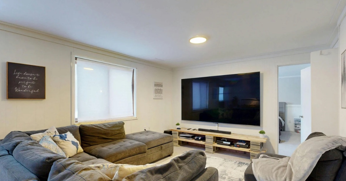 Wall-mounted TV and mounting bracket in a Columbus-area living room, a common gray area when selling a home