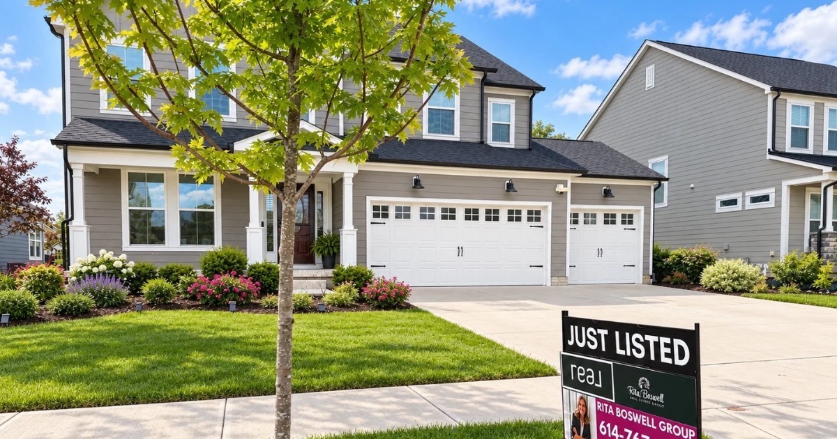 Two-story Central Ohio home with a for sale sign in the front yard