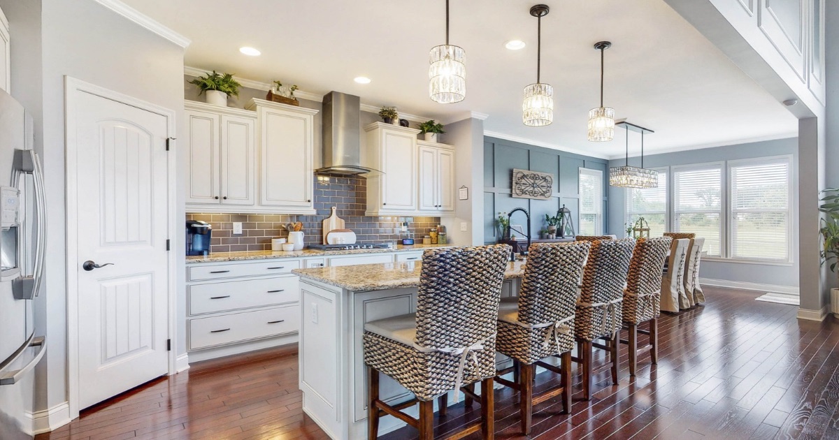 Central Ohio homeowners reviewing a purchase offer at their kitchen table