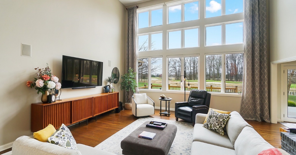 Bright spacious living room with large windows in a well-maintained Central Ohio move-up home