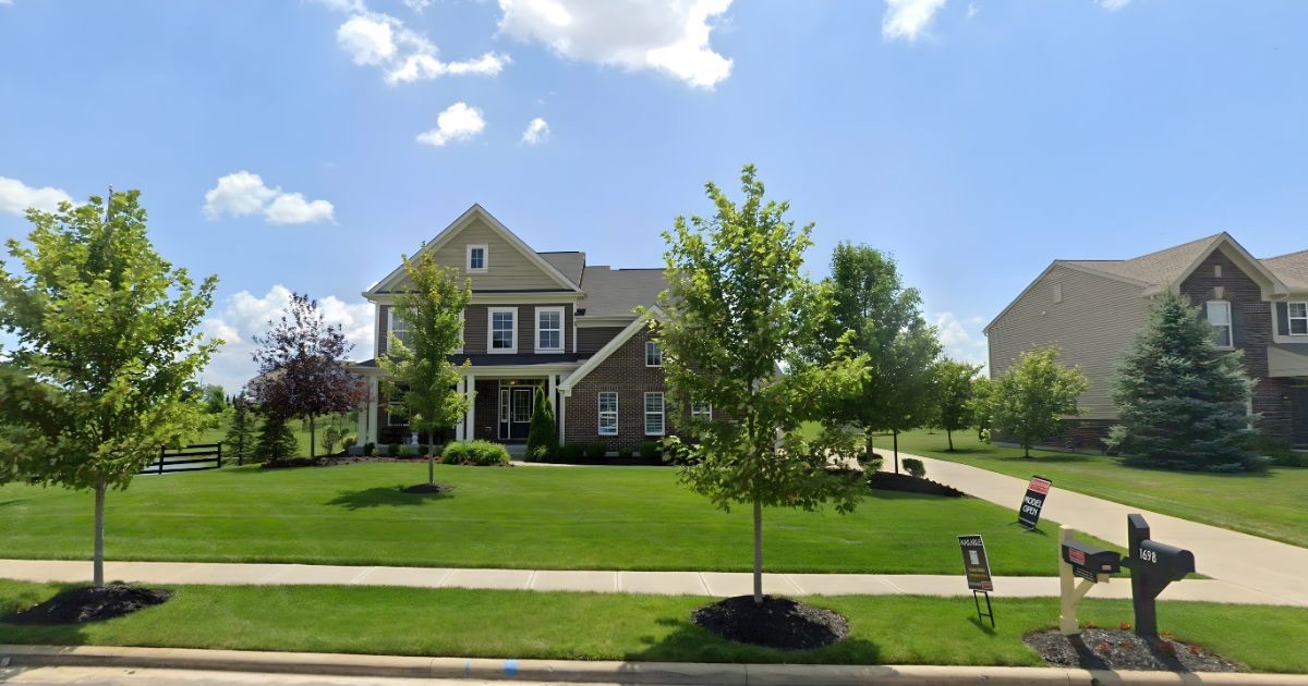 New construction home in a Columbus Ohio community with landscaped yard and neighborhood setting