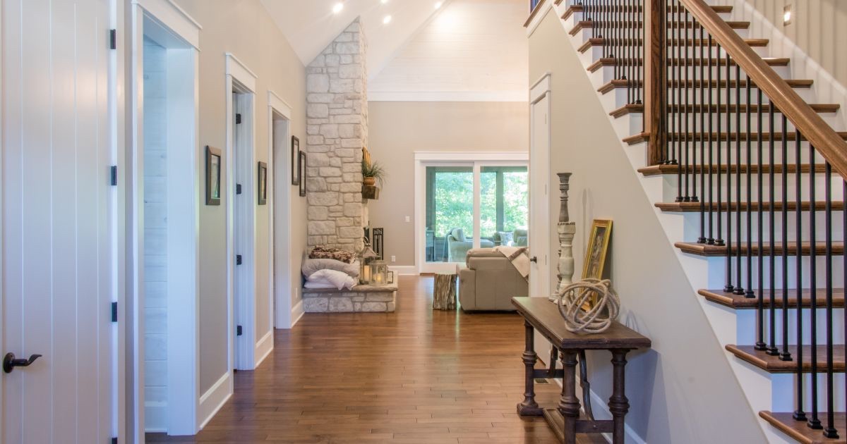 Staged entryway with console table, and natural light